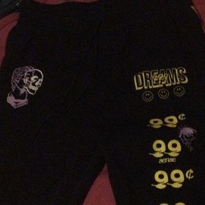 They are black with yellow and purple colored joggers